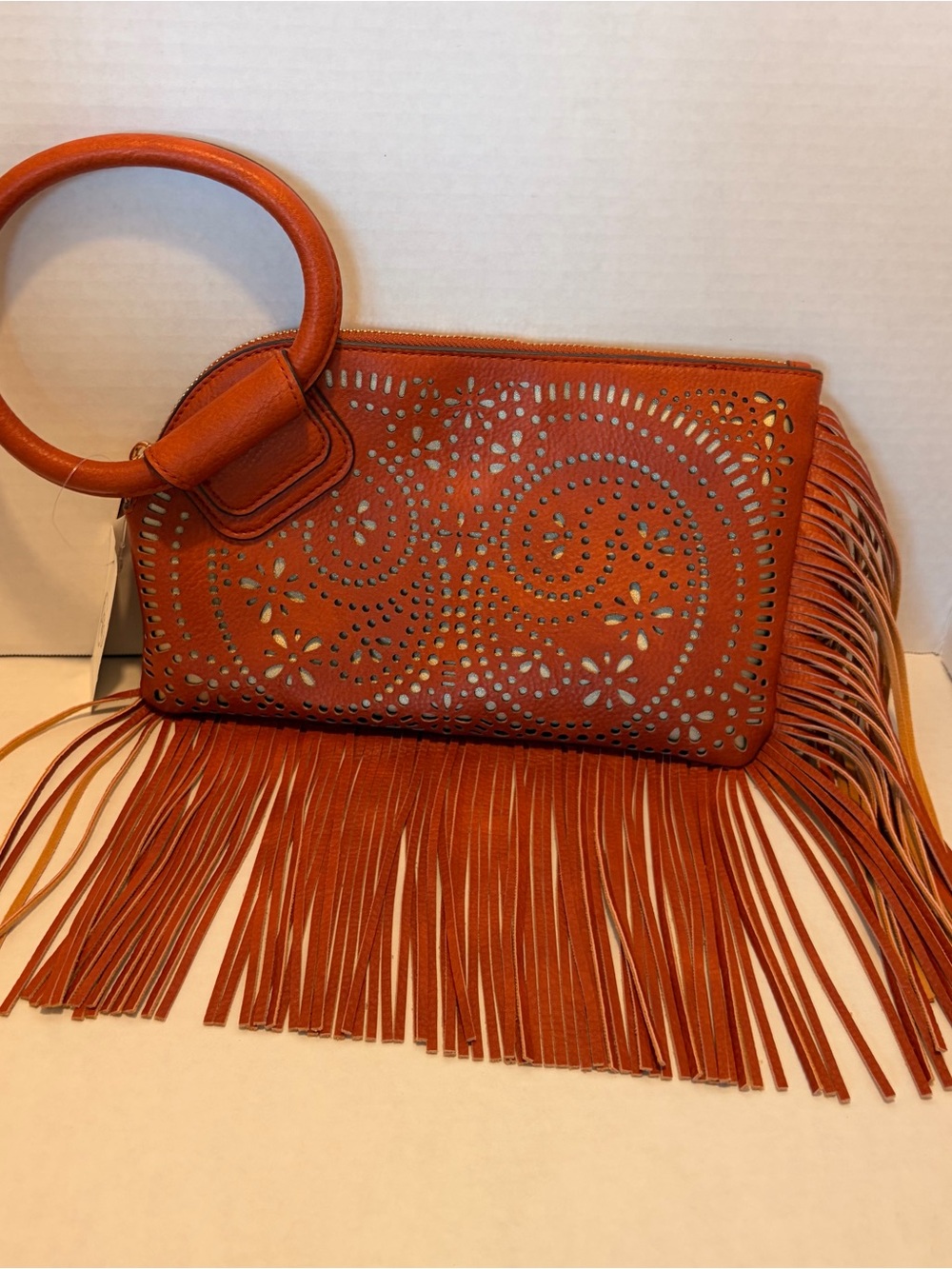 Cato Rust Orange Laser-Cut Fringe Wristlet Clutch